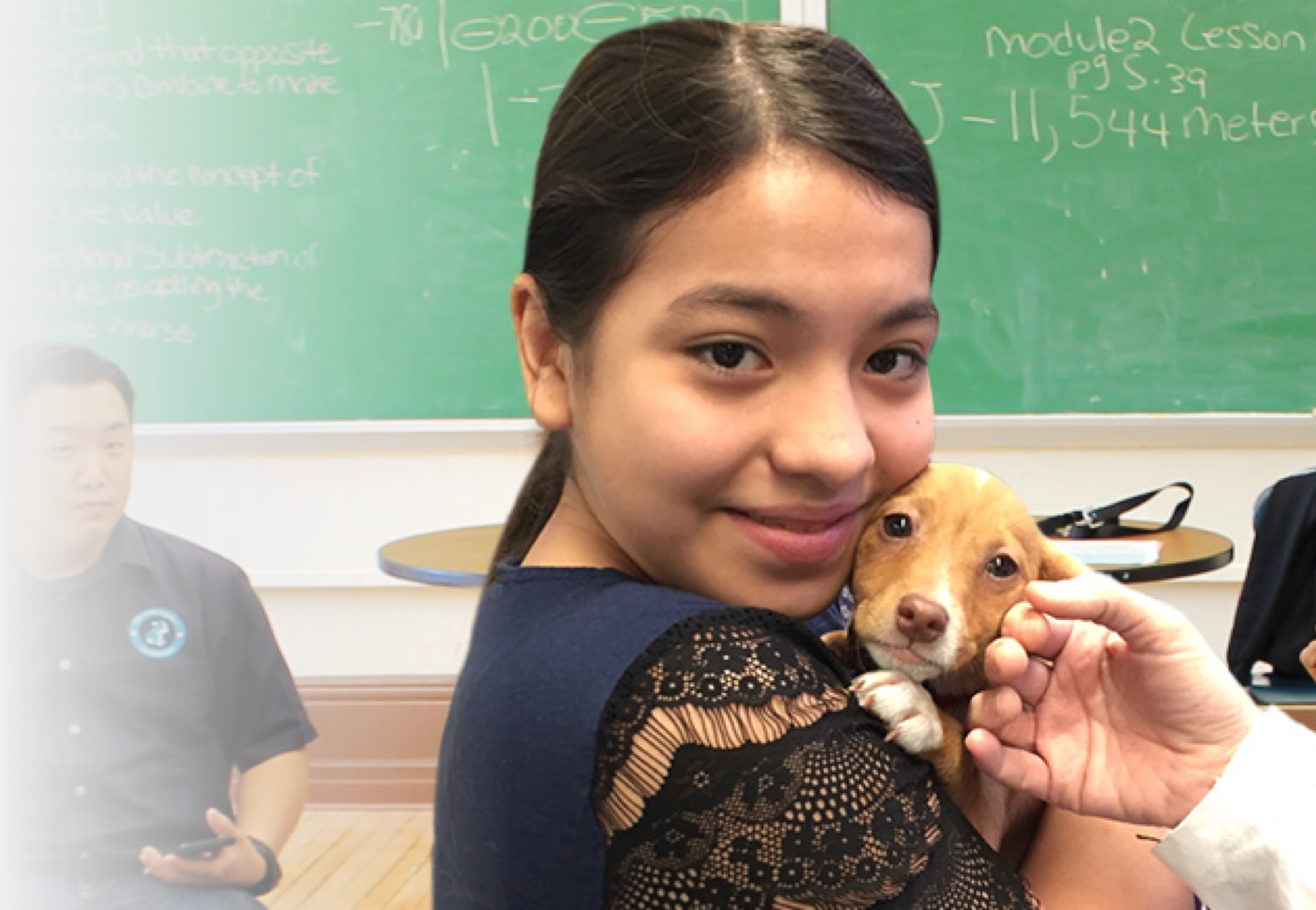 little girl holding a puppy