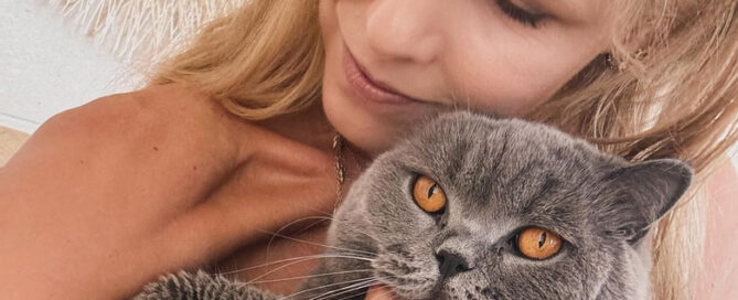 a woman holding a cat