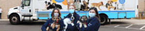 North Shore Animal League America rescue team members with rescue puppies.
