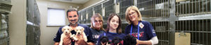 North Shore Animal League America rescue team members with rescue puppies.