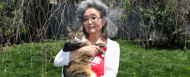 a woman holding a cat