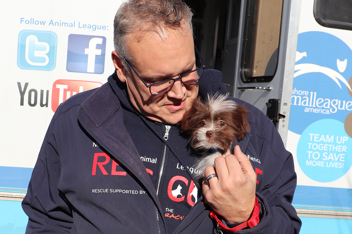 a man holding a dog
