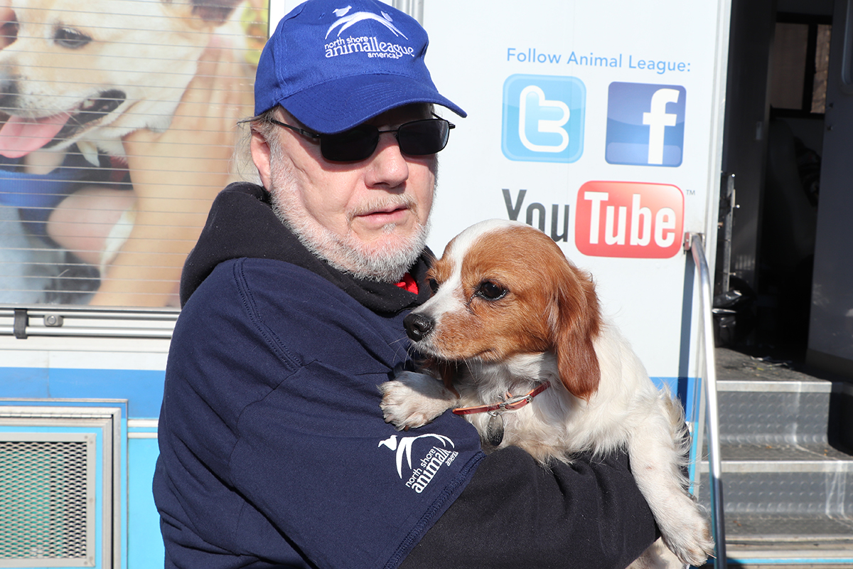 a man holding a dog