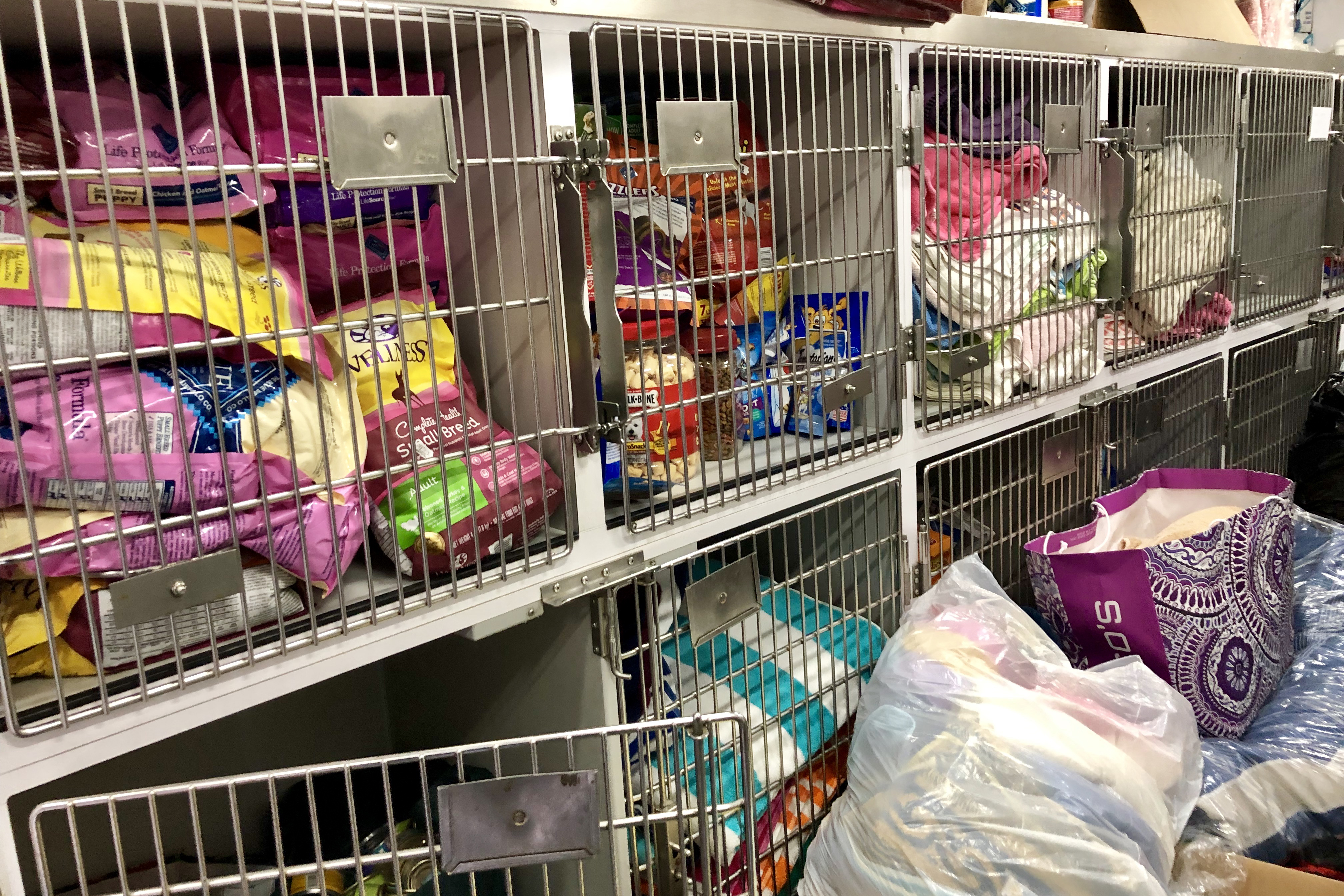 a group of cages with food in them