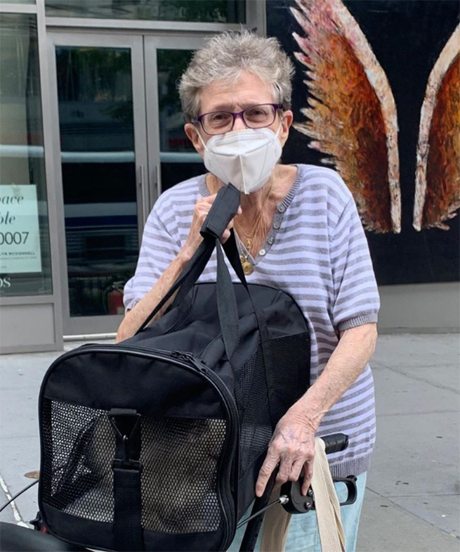 beth-blog-oct2020-lily-adopted an old woman wearing a face mask and holding a bag