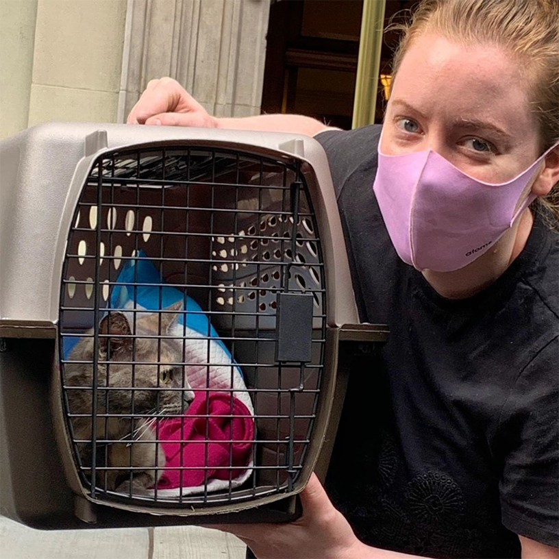 beth-blog-oct2020-mama-bessie-adopted a woman wearing a mask holding a cat in a carrier