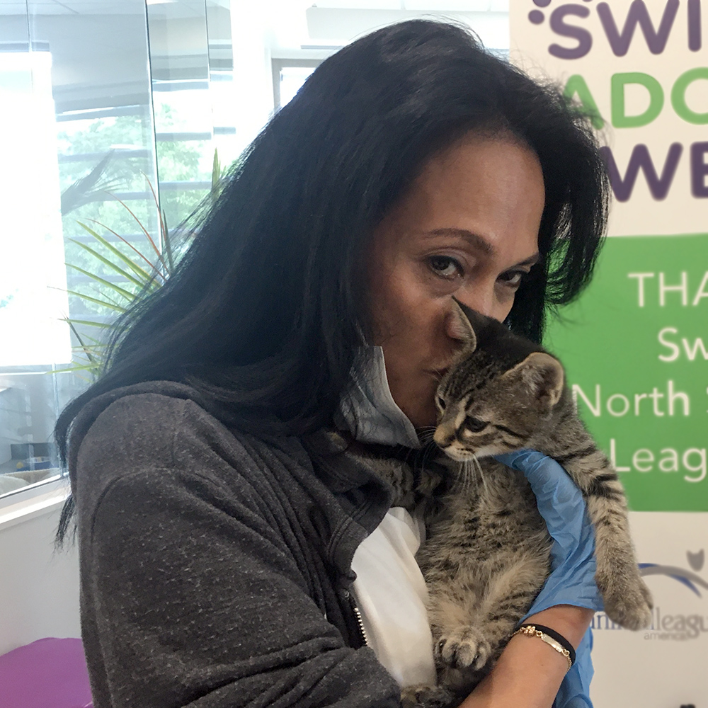 a woman holding a cat