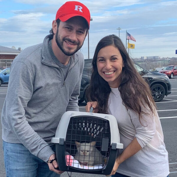 beth-blog-dec2020-tofu-adopters a man and woman holding a cat in a carrier