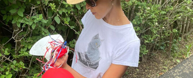 a woman wearing a hat and sunglasses