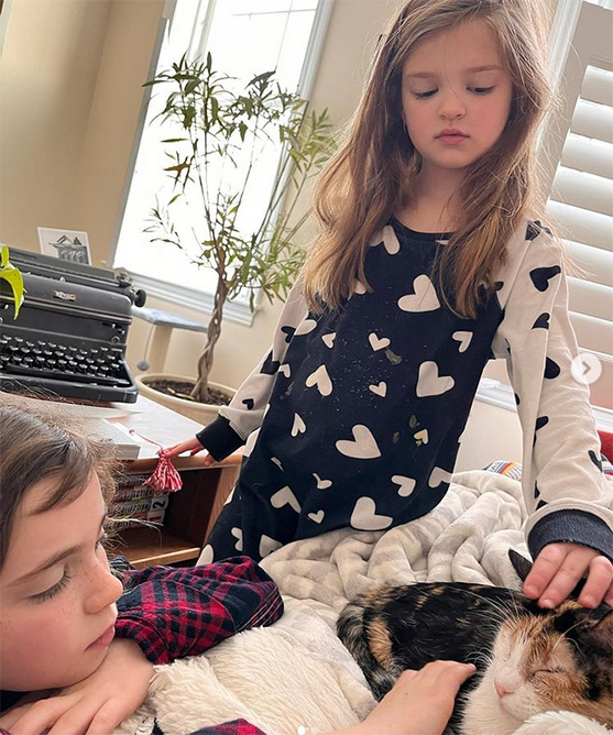 beth-blog-march2022-pandora-at-home a girl petting a cat