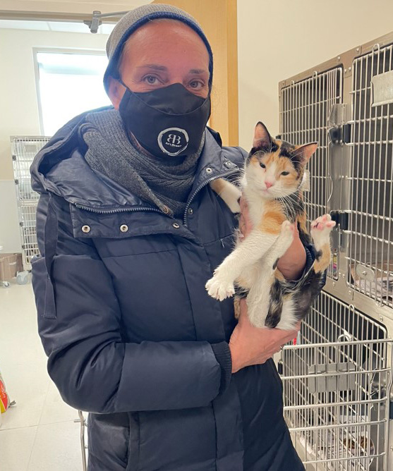 beth-blog-march2022-pandora a person wearing a face mask holding a cat