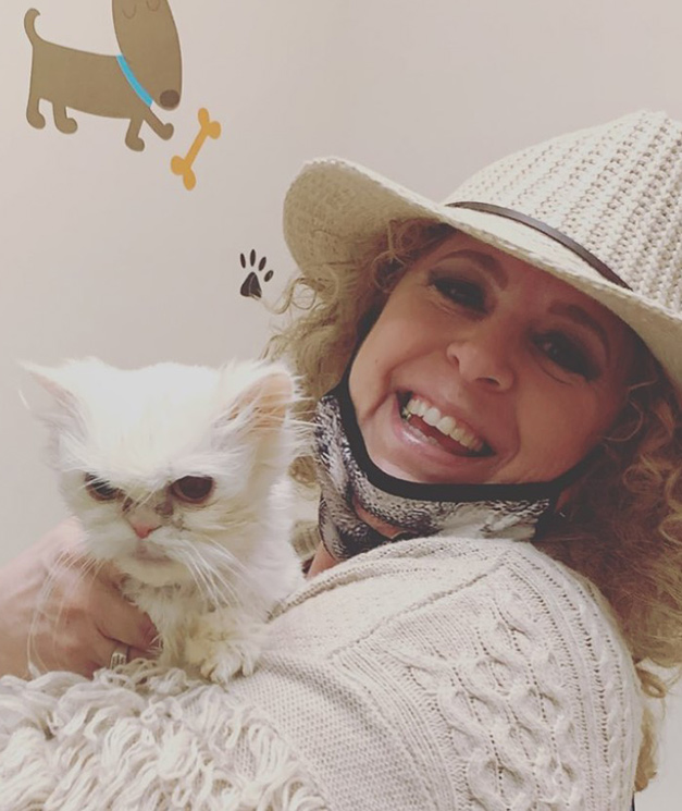 beth-blog-april2022-promis-adopter a woman holding a cat