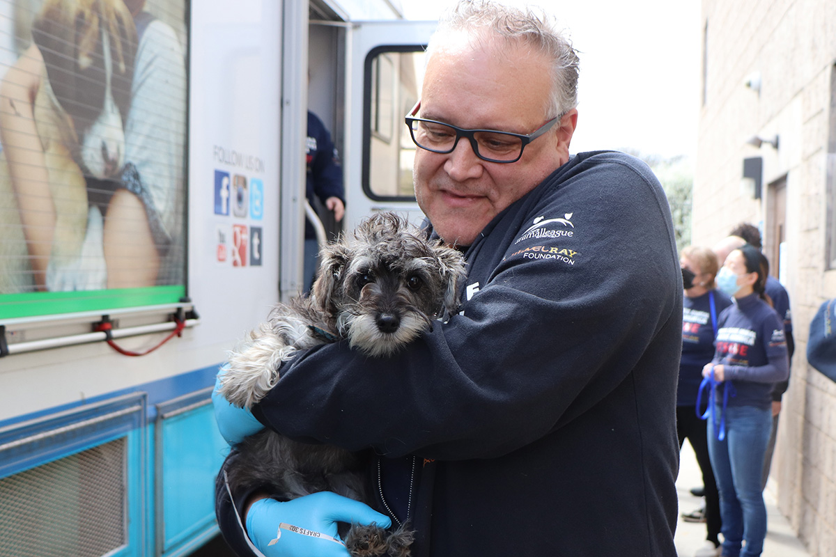 a man holding a dog