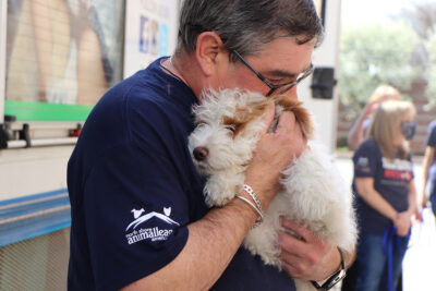 rescue-national-mill-dog-img3228-041622 a man holding a dog