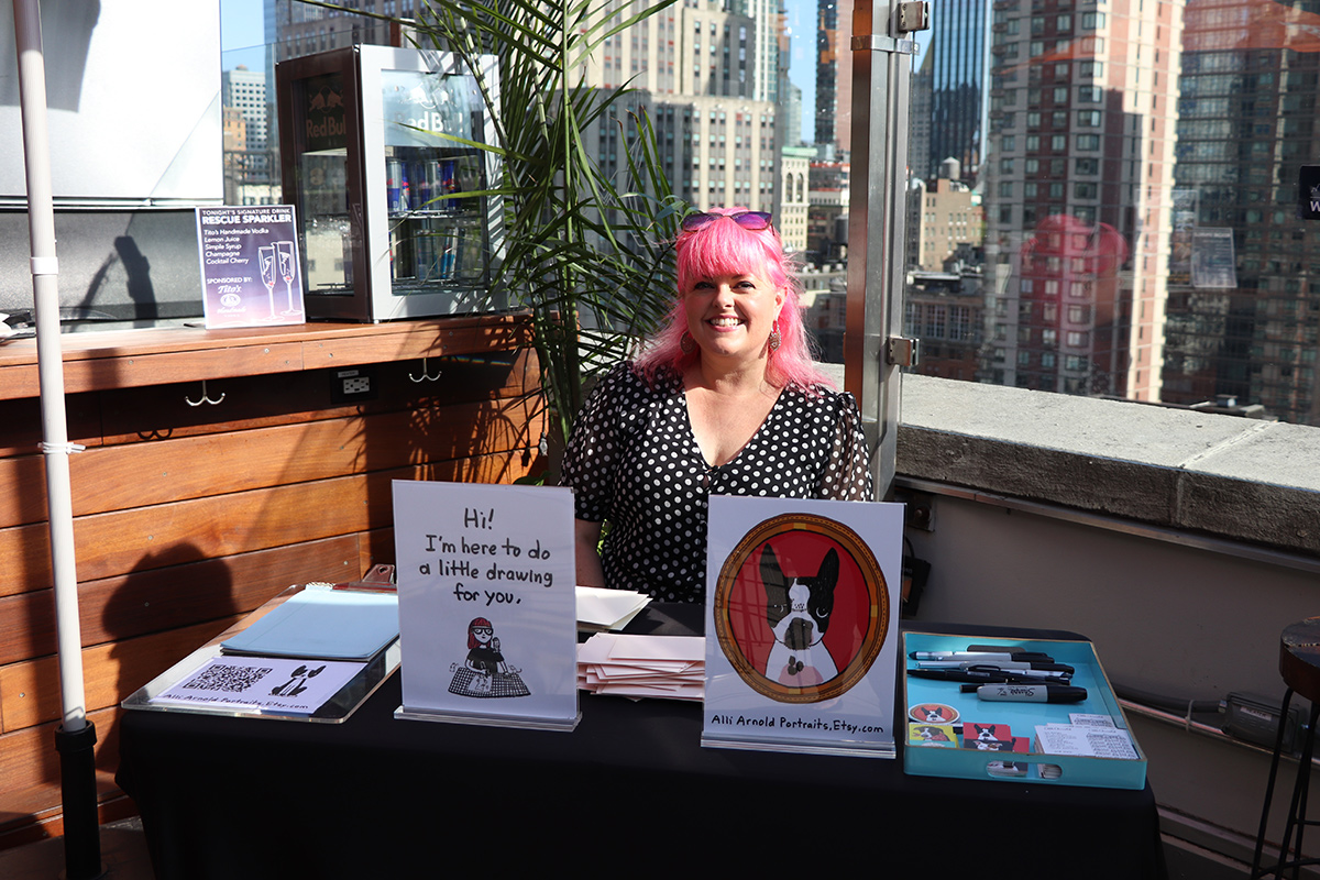 a woman sitting at a table with a picture of a dog