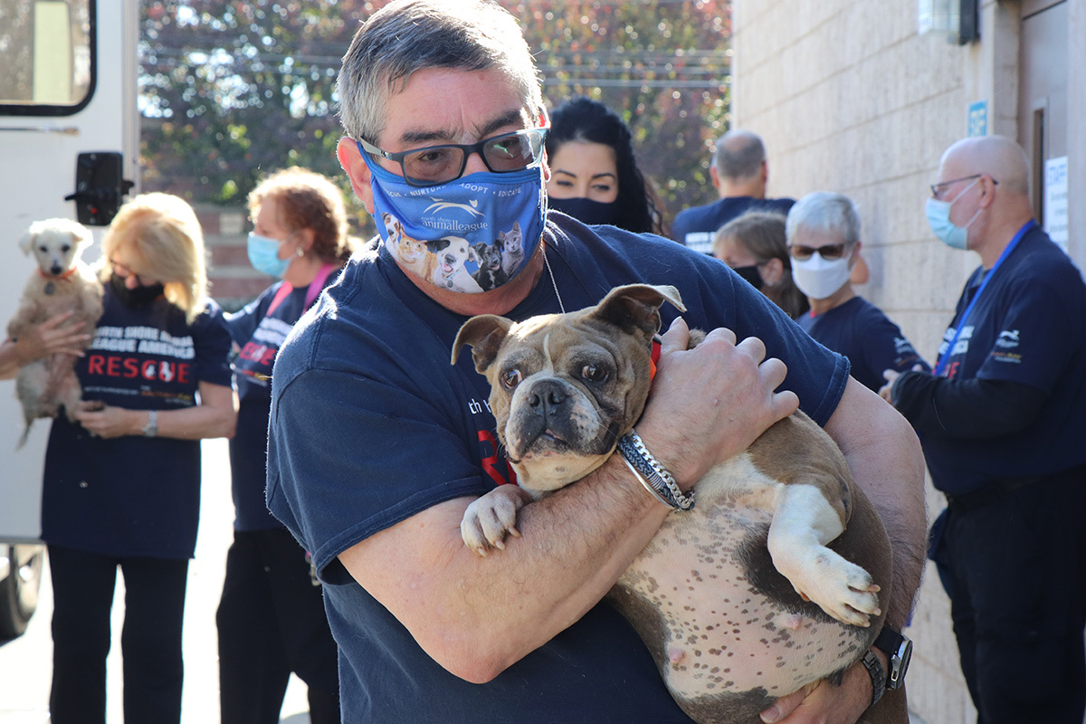 a man holding a dog