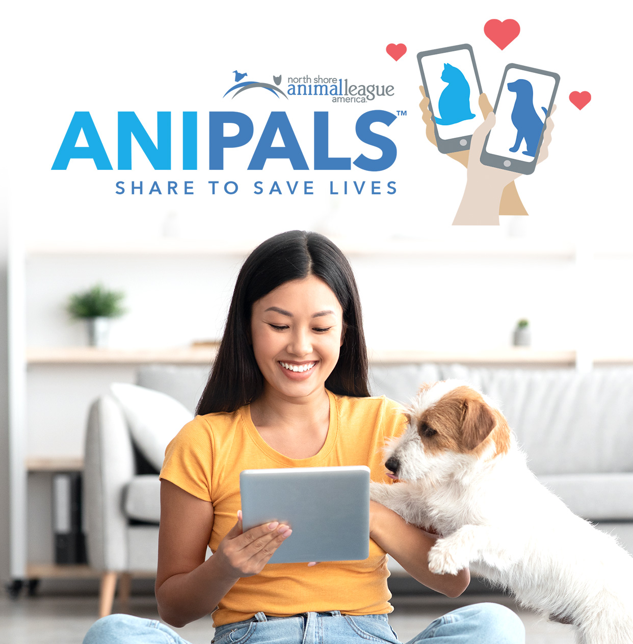 a woman sitting on the floor with a dog and a tablet