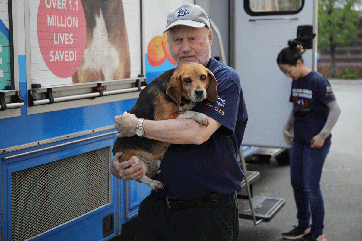 a man holding a dog