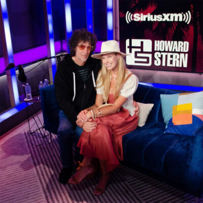 beth-blog-june2023-howard-and-beth a man and woman sitting on a couch