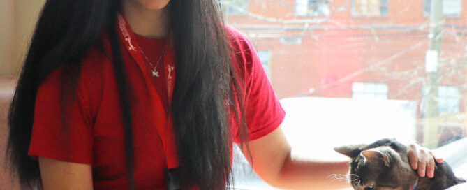a woman with long hair holding a phone