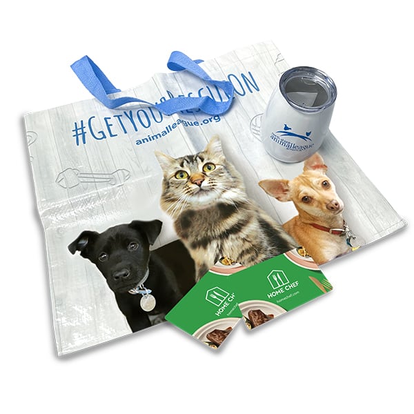 a bag with a picture of dogs and a can