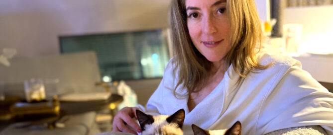 a woman holding a cat